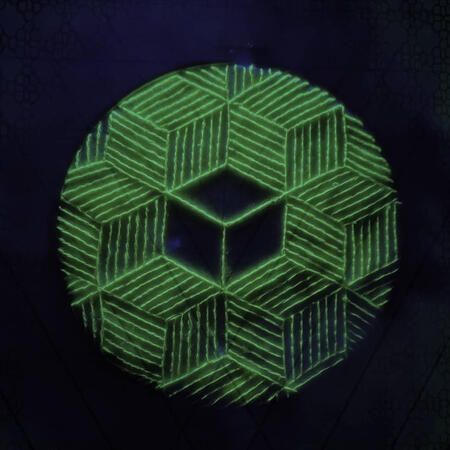 Embroidery: A circular pattern of neon-green embroidery stitches forming interlocking cubes. The actual embroidery was made by my wife with glow-in-the-dark filament, picture taken and edited by me.